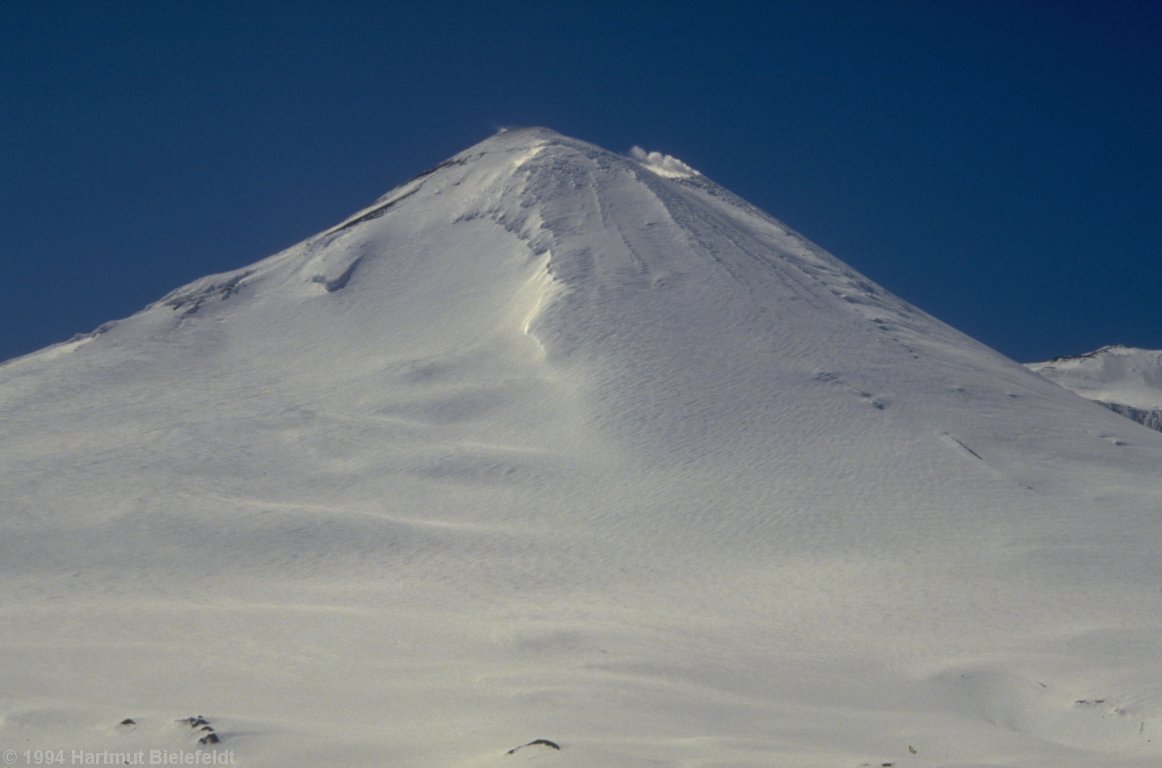 Llaima seen from a distance. From this perspective also the big crater can be seen.