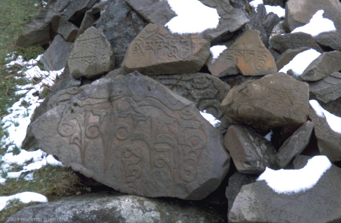 Mani stones near the monastery.