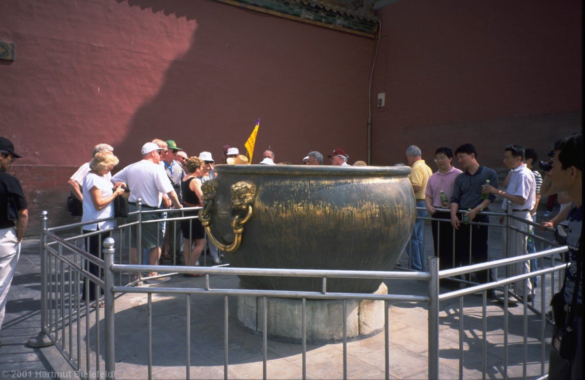 The tubs contain water for fire-fighting. In the cold Beijing winters, freezing was prevented by fires below the tubs (!)