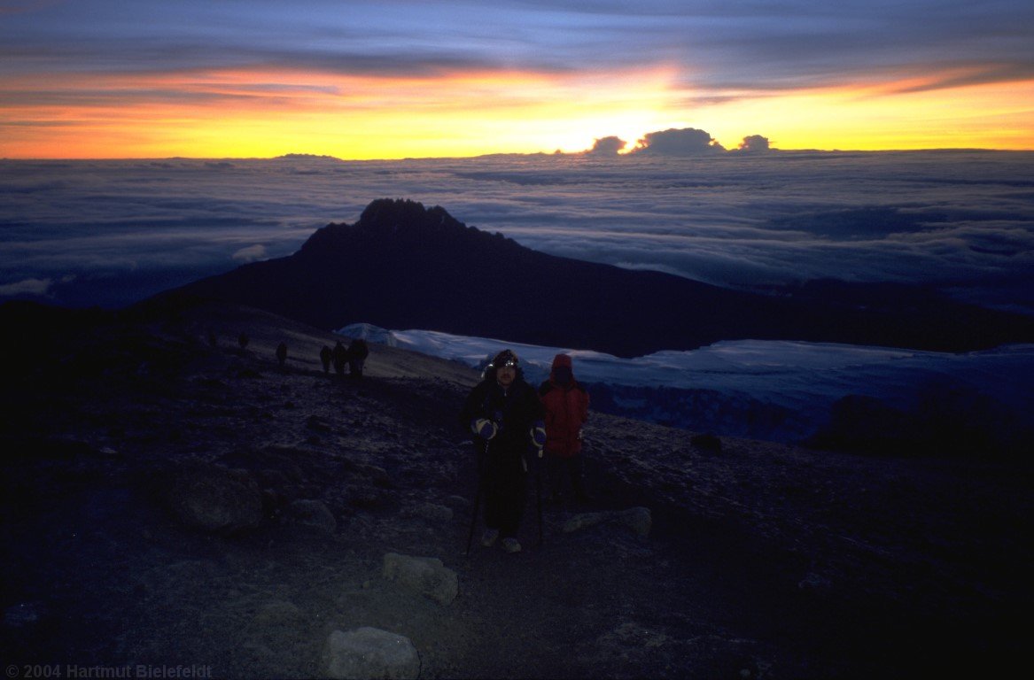 Shortly before we reach Uhuru Peak, the sun is rising