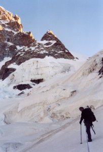 The bivouac is standing on the left side beneath Pic Eccles. The fall happened on the upper right near the shadow border