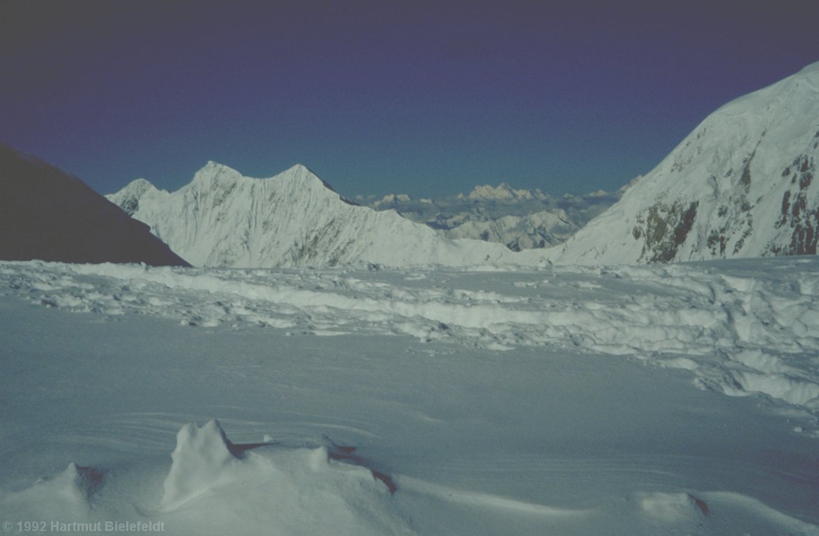 cragged mountains in the south, far away the other 7000ers of the Pamirs