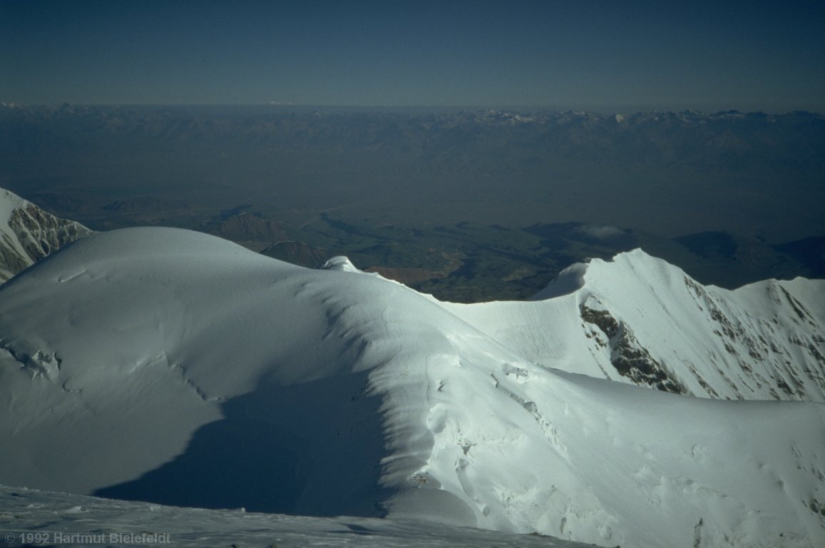 In the saddle below Peak Razdelnaya, camp 3 can be seen