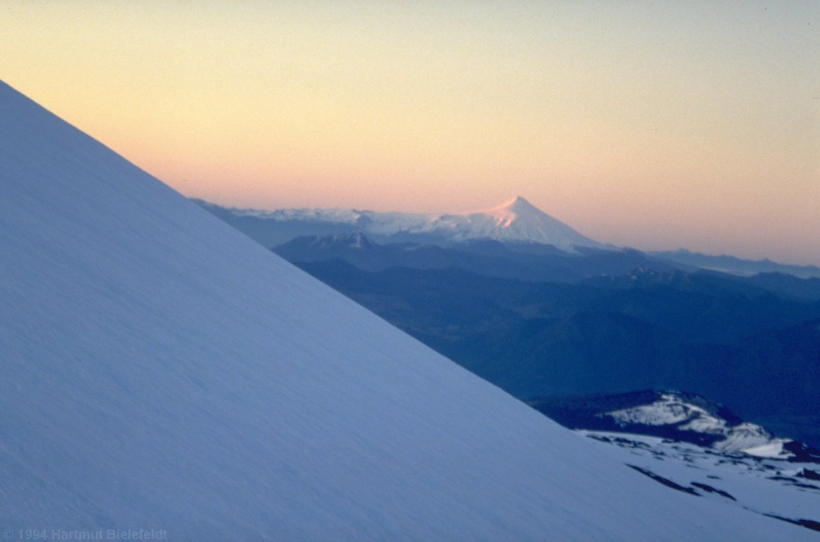 Morning at Llaima, Villarica volcano is our nearest neighbor.