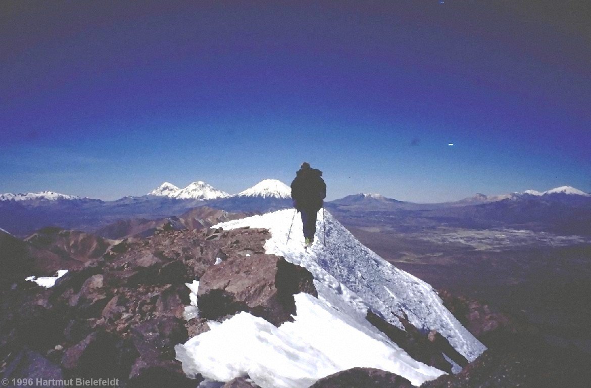 Summit ridge of Cerro Taapacá, 5775 m. In the background Sajama, Pomerape, and Parinacota.