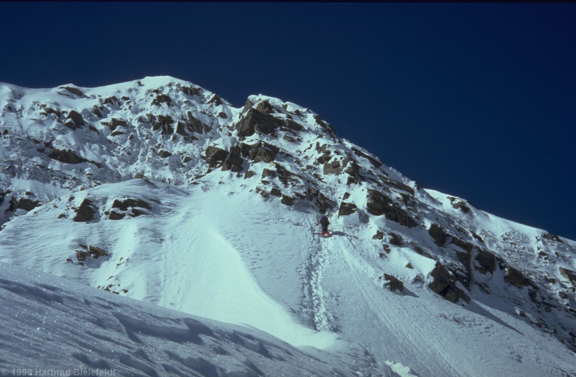 The icy rock step would be a serious problem without fixed ropes.