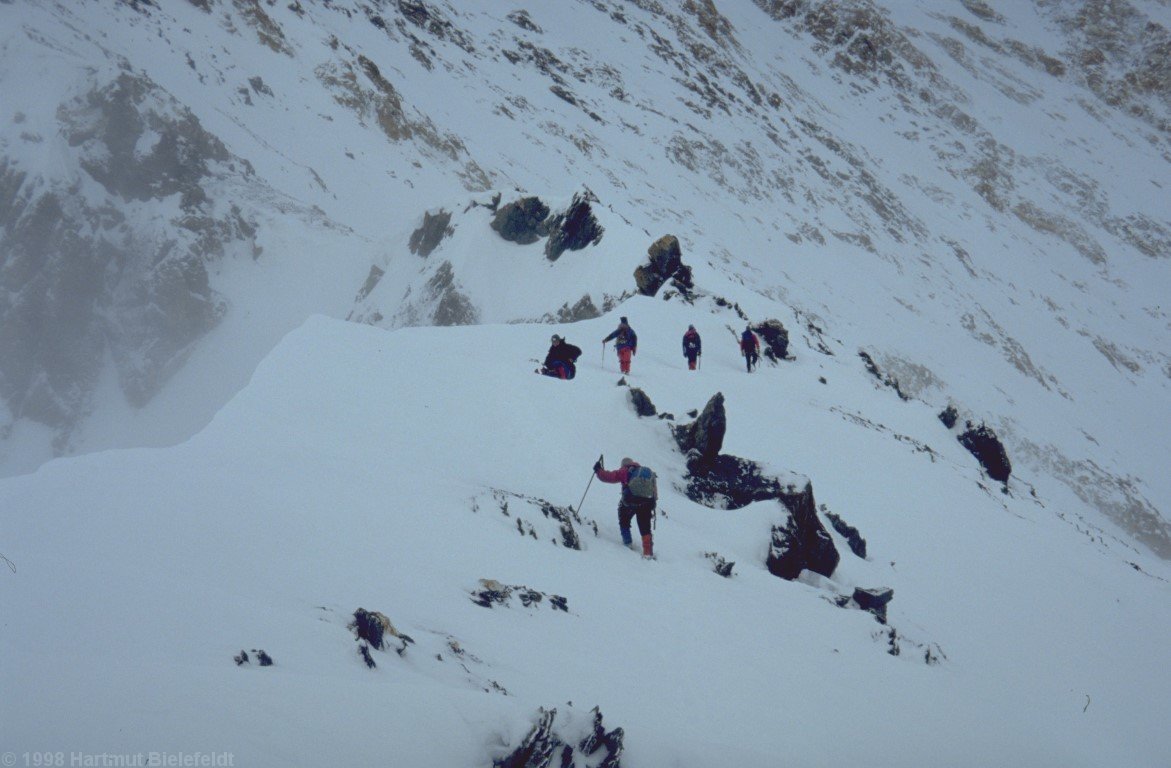 Next morning, we follow the flat portion of the ridge in moderate weather.