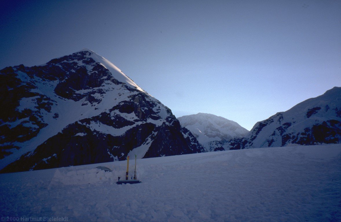 our objective, Denali, peers from the background