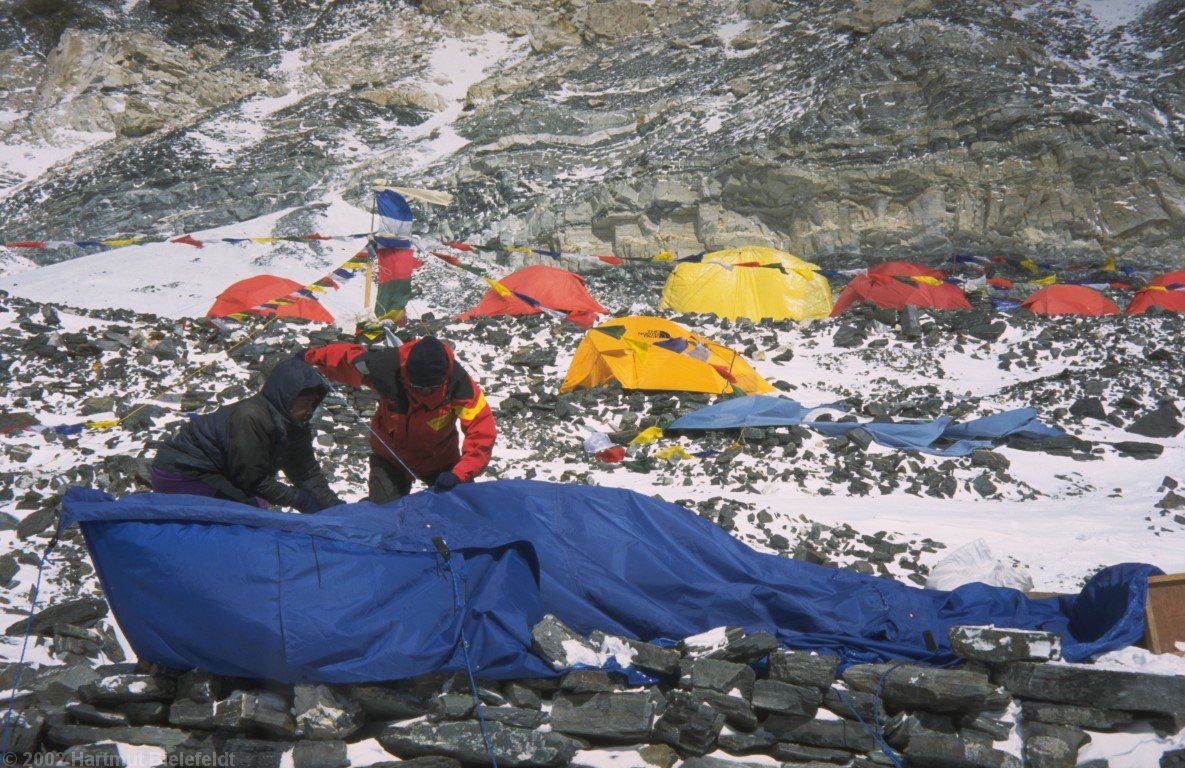 A new kitchen tent is being composed out of the rests of the two tents.
