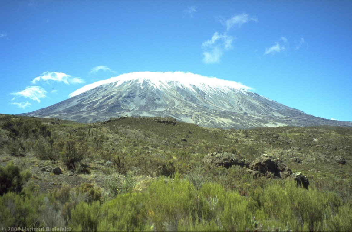 The summit plateau wears a cloud cover