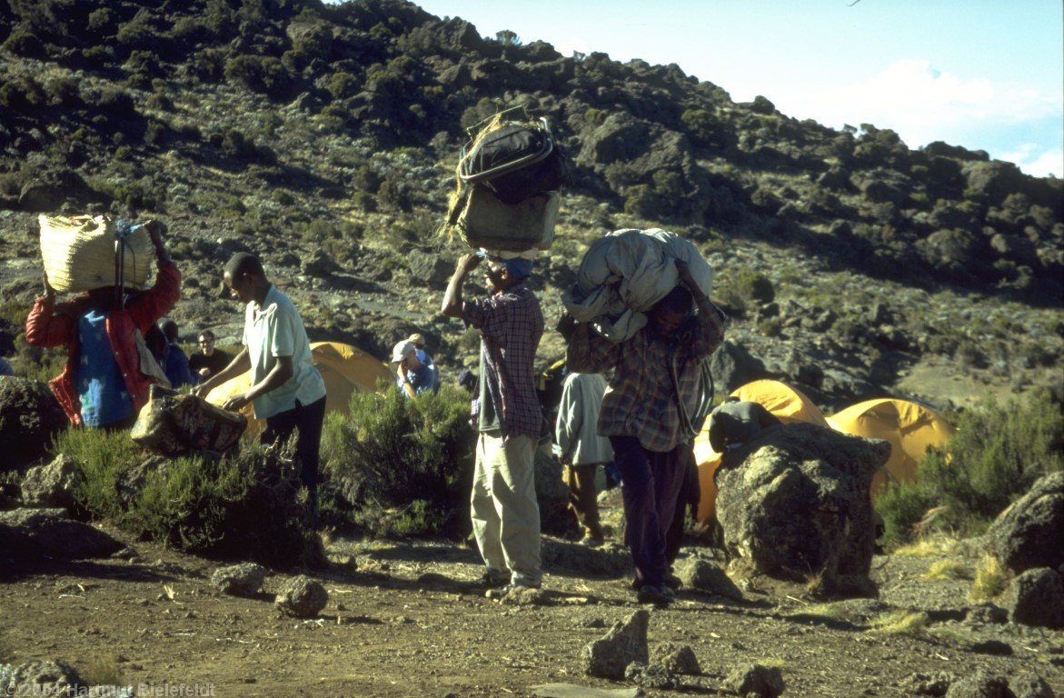 Some porters arrive before, some after the mountaineers.