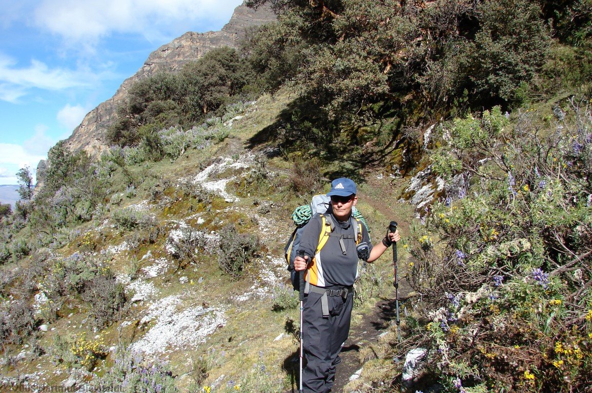 the muddy trail leads to steep terrain