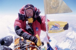 Tom with mountain school flag